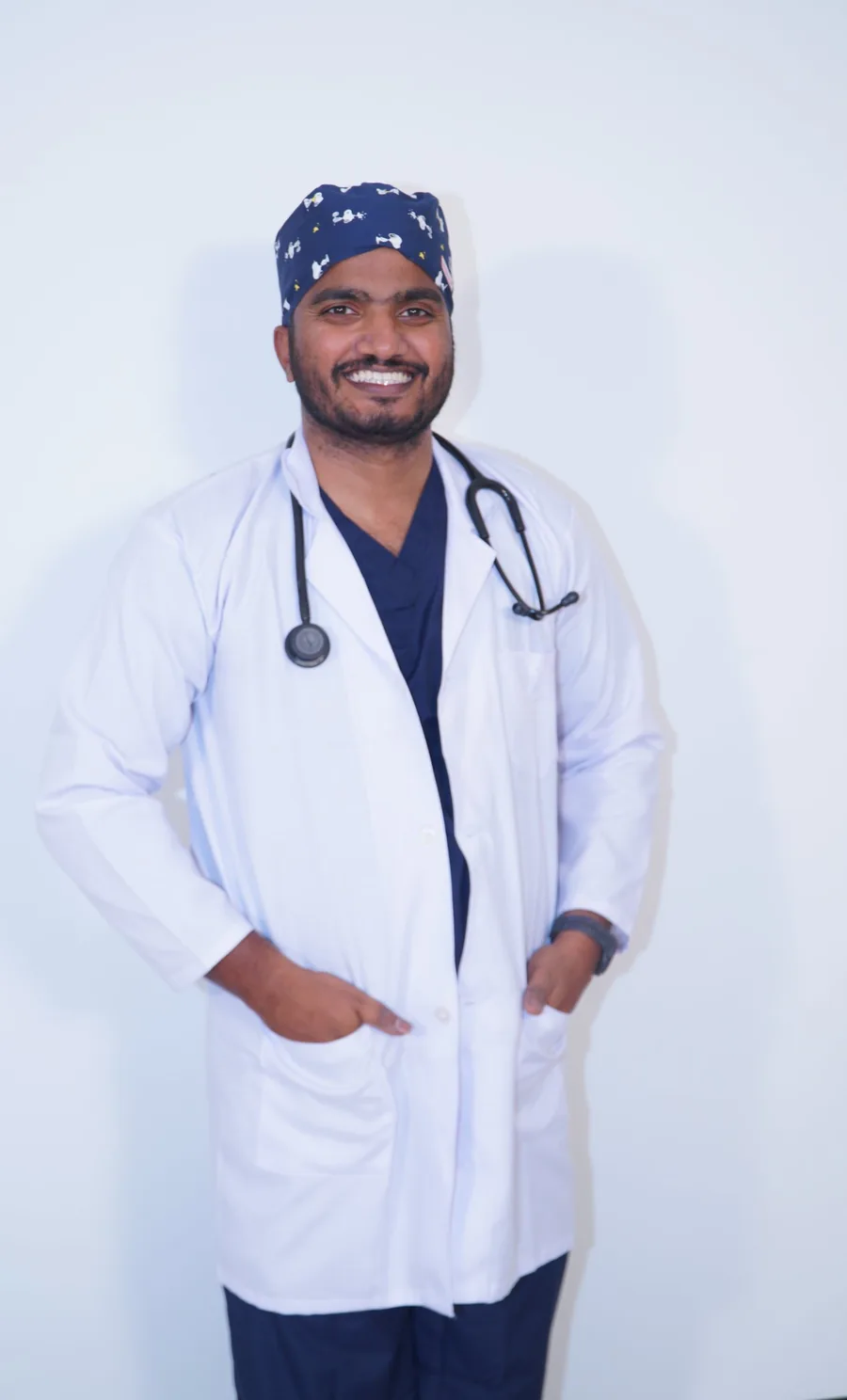 Dr. Akif smiling in a white coat